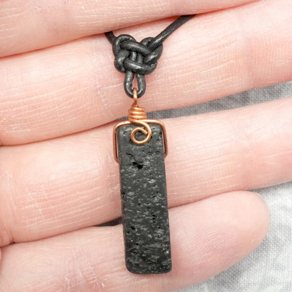 Copper, lava stone and leather necklace.