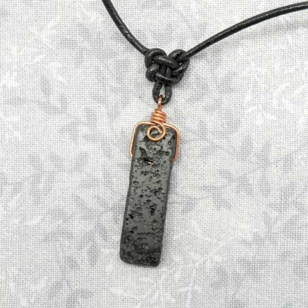 Copper, lava stone and leather necklace.