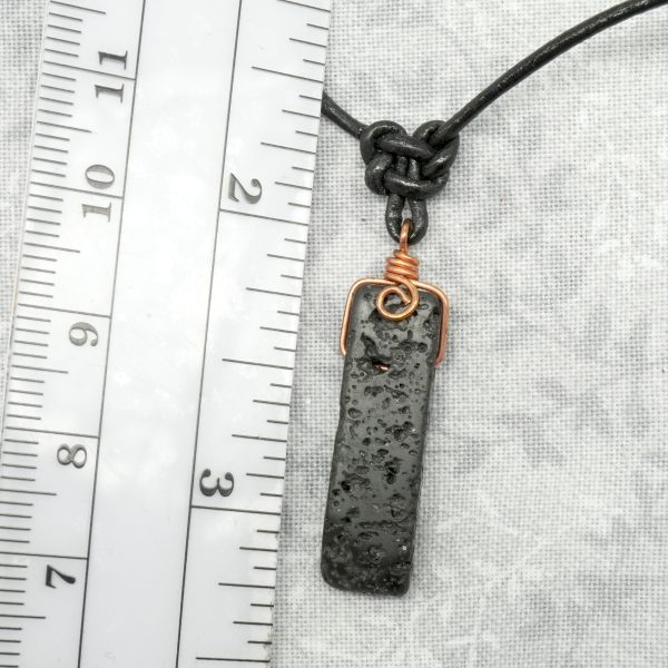 Copper, lava stone and leather necklace.