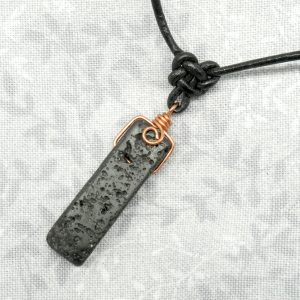 Copper, lava stone and leather necklace.