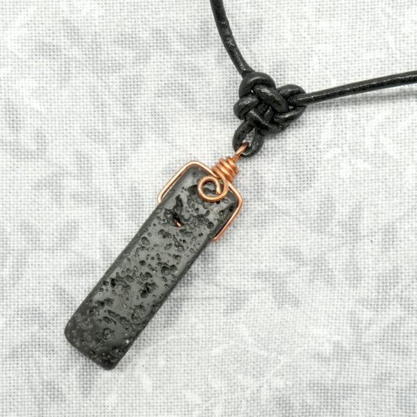 Copper, lava stone and leather necklace.
