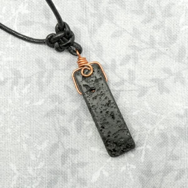 Copper, lava stone and leather necklace.